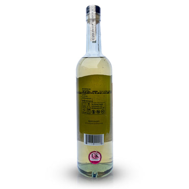 Back view of a 700ml bottle of Cascahuin Reposado Tequila featuring a clear glass design that allows for a perfect view of the golden colour tequila reposado inside. The outside of the bottle is adorned with labels specifically designed for the UK market.