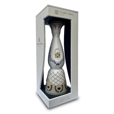 700ml white ceramic bottle of Anejo tequila with display case.