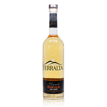 Terralta Extra Añejo is bottled in sleek, handcrafted glass. The bottle's design includes the logo, which features "TERRALTA" in bold, serif font with "Extra Añejo" below. The label also prominently mentions "100% Agave".